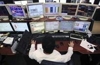 World stocks, bond prices drop as Fed points to reduced bond buying